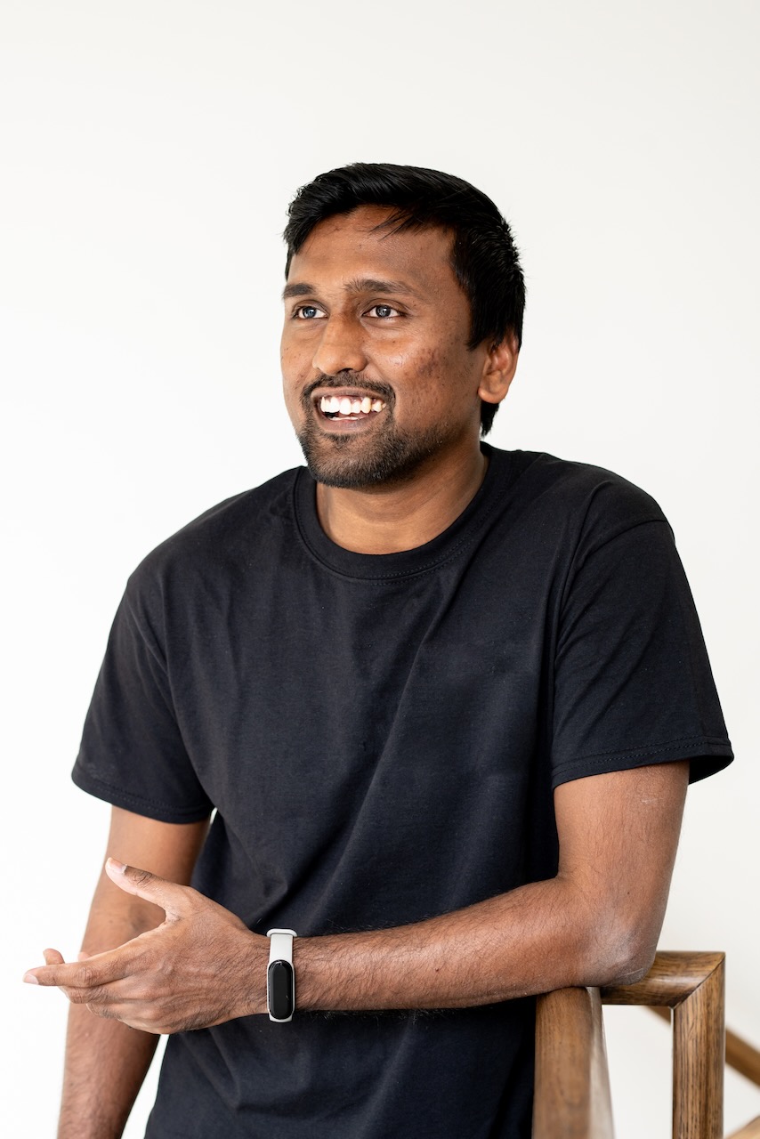 Author Murali sitting in a gathering
