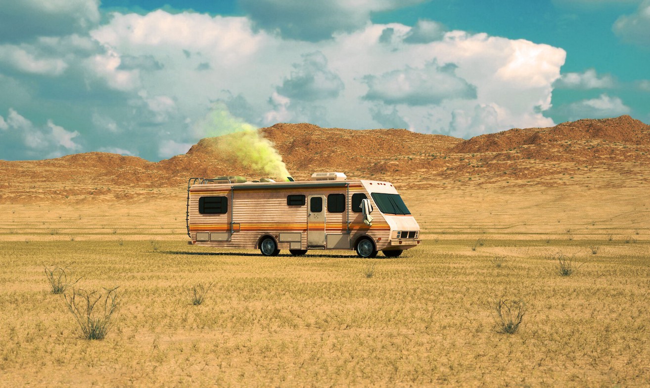 A van in a desert emitting yellow gas